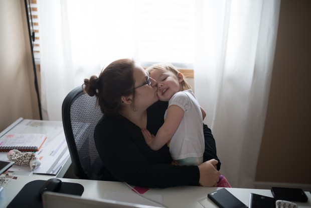 Jennifer Togal at Desk With Child