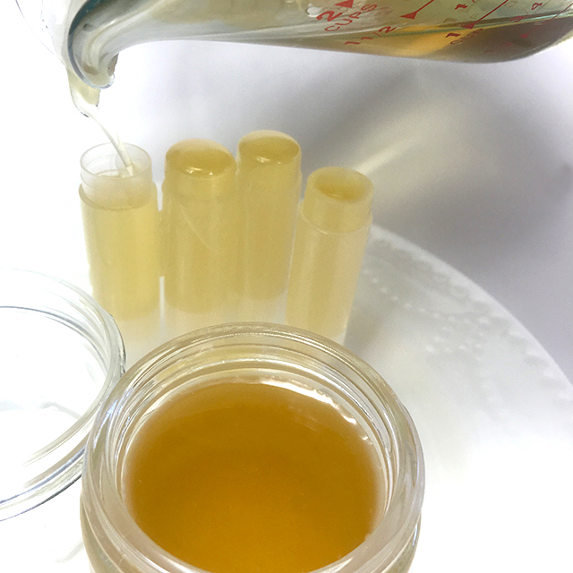 Pour a little bit of your lip balm mixture into your containers and wait for it to set!