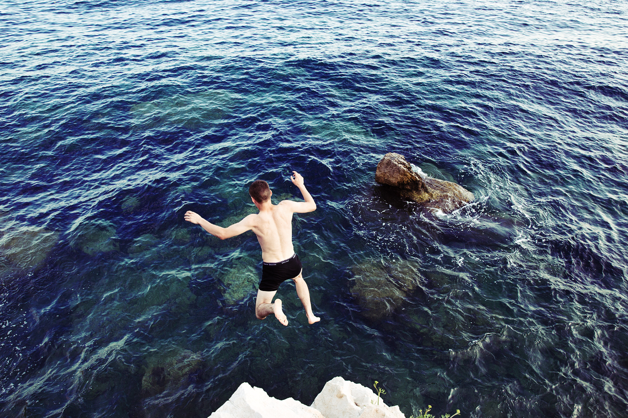 2015-04-Life-of-Pix-free-stock-photos-jump-people-boy-sea-rock-back-EZE-Joshua-earle