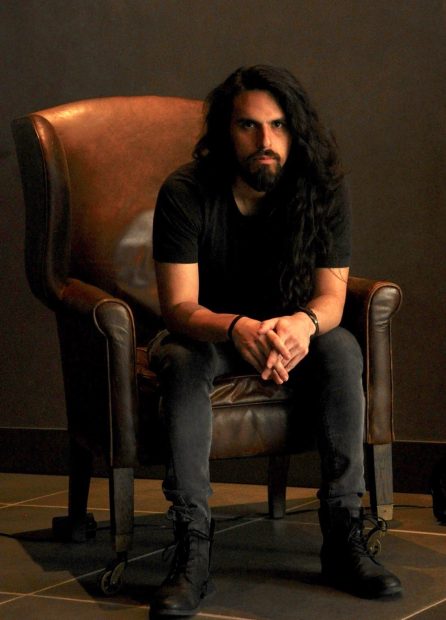metal musician, Micheal Nolasco, sits for a photograph