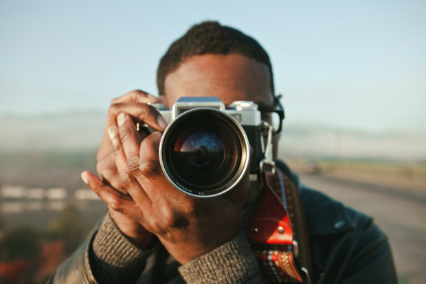 Man taking photos with a vintage camera 