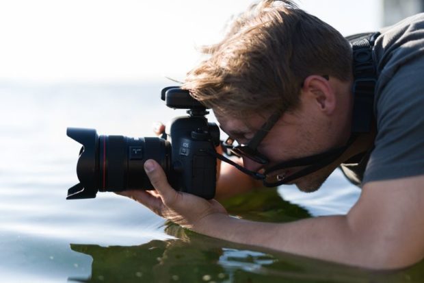 Man with digital camera