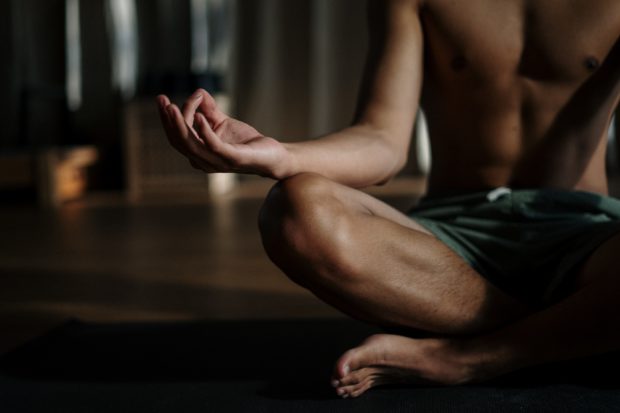 man sitting in meditation 