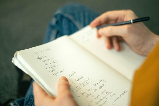 person creating an action list to combat feeling stuck 