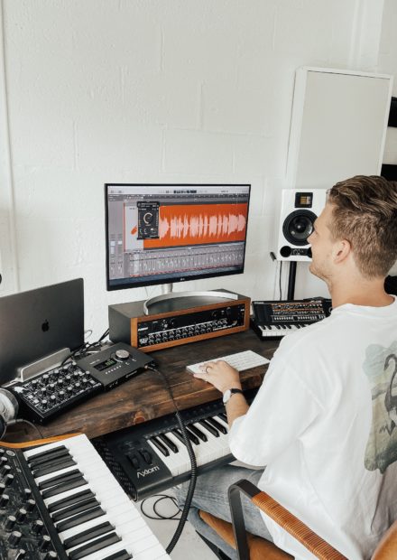 man using music producing software 