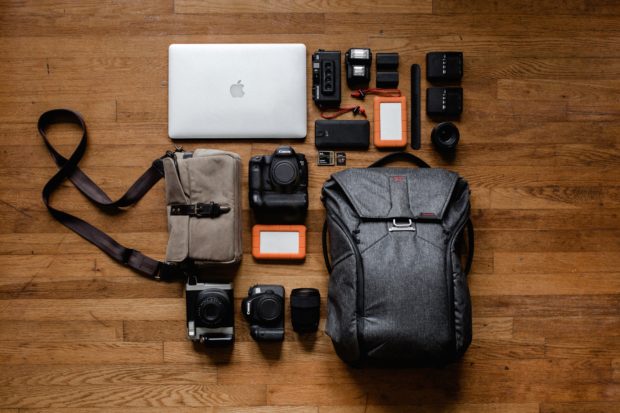 Photography equipment arranged on a wooden floor